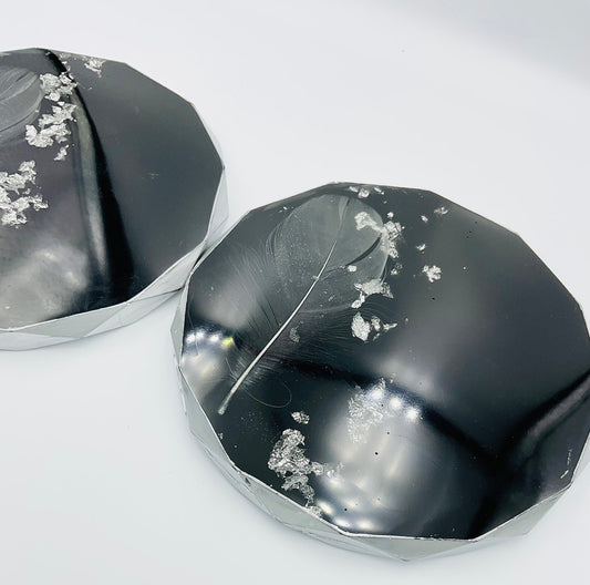 Black and Silver Resin Coasters with a white feather